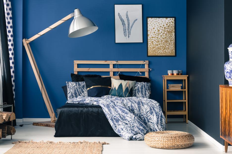 Royal blue bedroom interior with a touch of gold