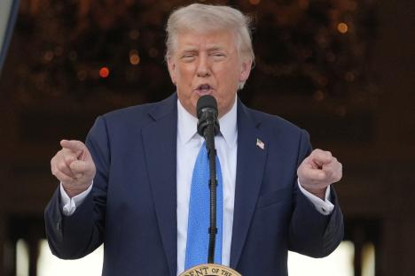 President Donald Trump speaking at a podium.