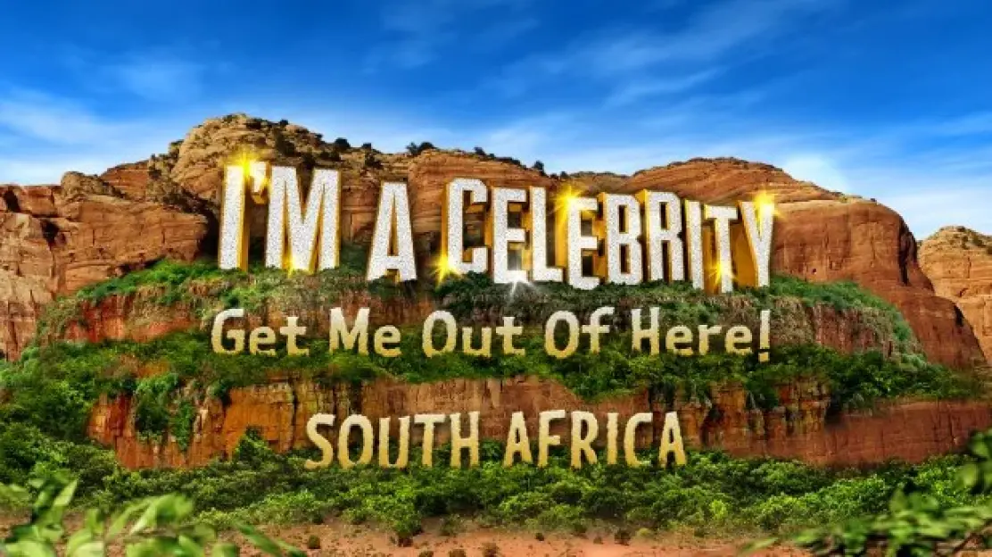 "I'm A Celebrity... Get Me Out Of Here! South Africa" logo on a rocky landscape.