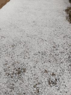 Hailstones covering the ground.
