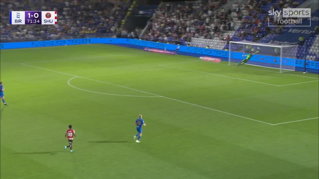 Soccer player taking a shot on goal.