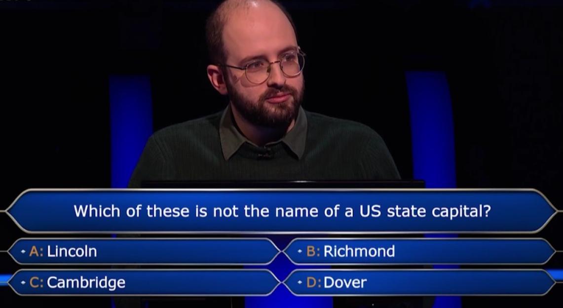 Screenshot of a contestant on Who Wants to Be a Millionaire? answering a question about US state capitals.