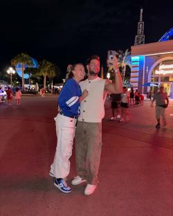 Couple taking a selfie at night.