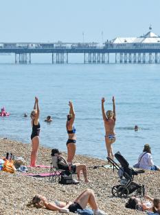 People enjoying a hot day at the beach.