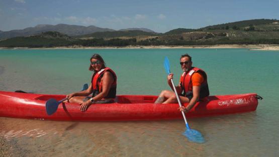 Couple kayaking on a lake.
