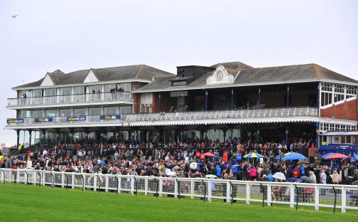General view of Ayr racecourse main stand with spectators.