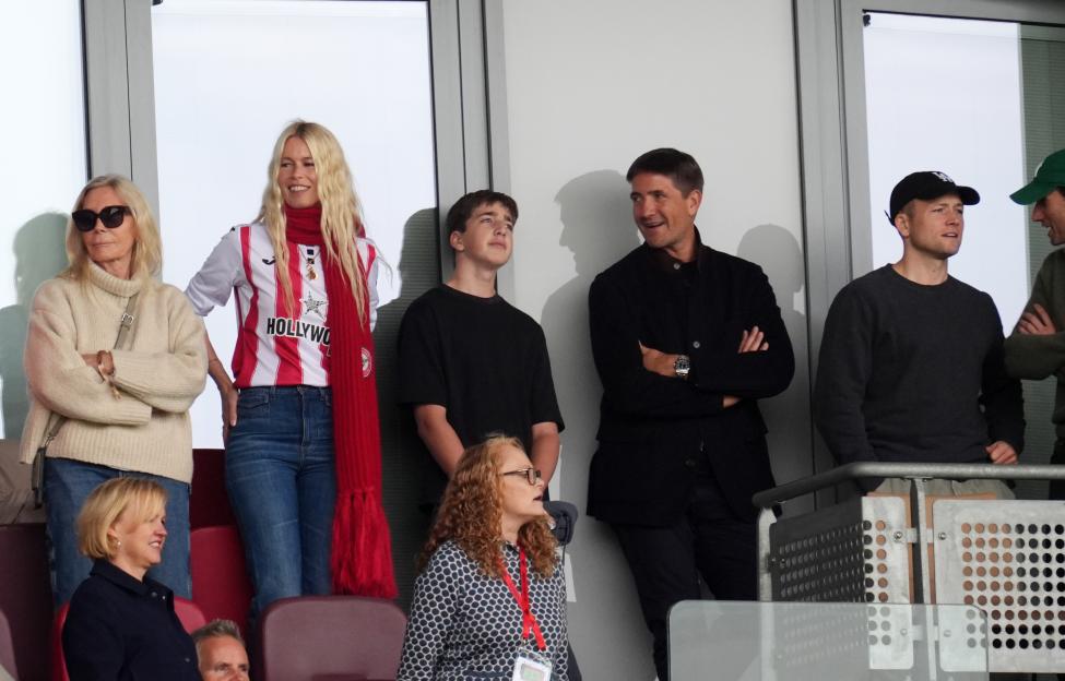 Claudia Schiffer and Taron Egerton in the stands at the Gtech Community Stadium.