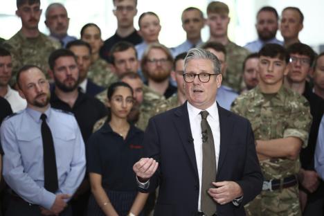 Keir Starmer speaking to a group of uniformed personnel.