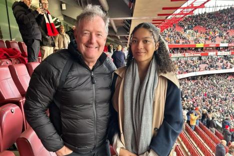 Rarely-seen daughter of 80s pop legend poses with Piers Morgan at the football – can you guess her famous mum?