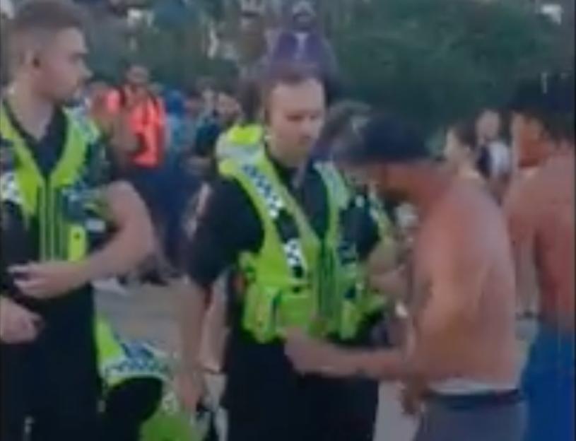 Moment mass brawl breaks out on Bournemouth beach as topless youths ‘hurl glass at cops’ in front of horrified crowds