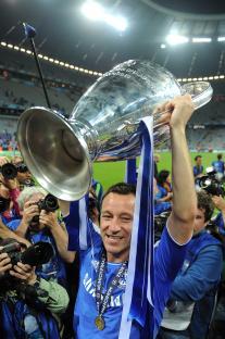 John Terry of Chelsea FC lifts the UEFA Champions League trophy.