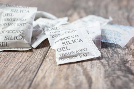 Close-up of several desiccant silica gel packets.