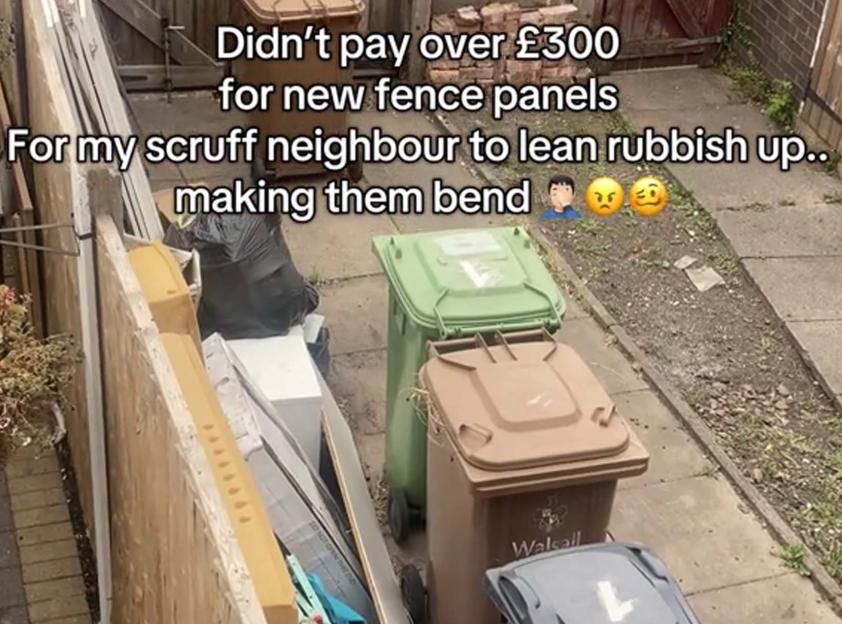 Rubbish leaning against a new fence.