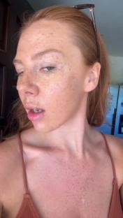 Woman with freckles and reddish-blonde hair.