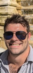 Close-up of a man wearing sunglasses.
