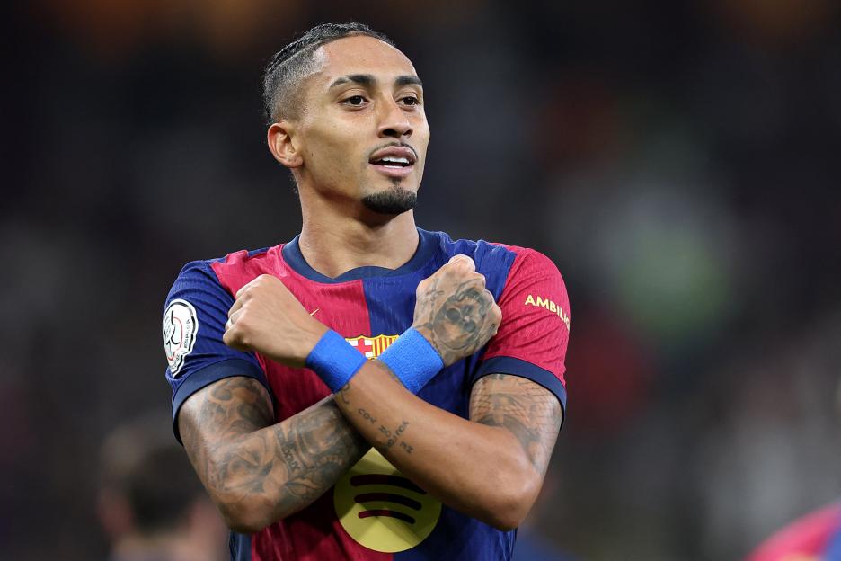 Raphinha, Barcelona's #11, celebrates scoring a goal.