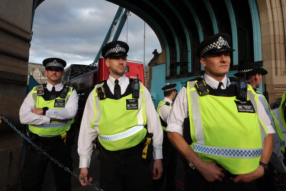 Police officers present at a protest blocking Tower Bridge.