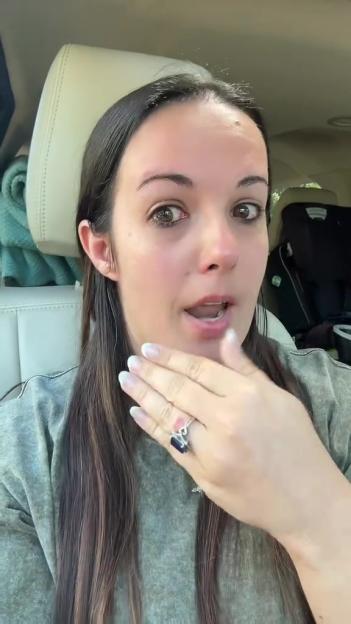 Woman crying in a car.