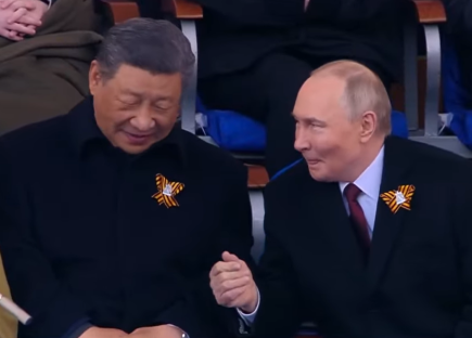 Xi Jinping and Vladimir Putin seated together.