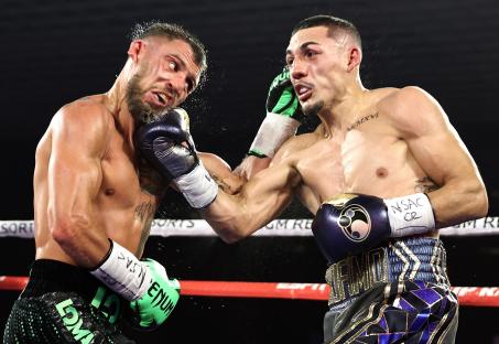 Handout image of Vasiliy Lomachenko and Teofimo Lopez Jr. boxing.
