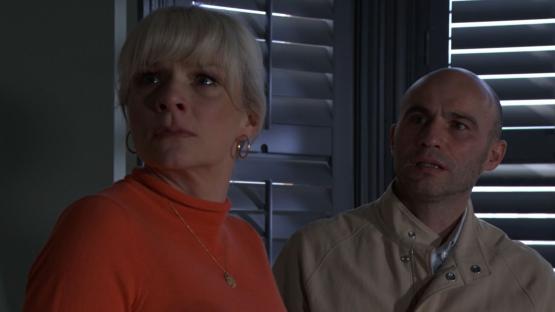A woman and a man looking concerned.