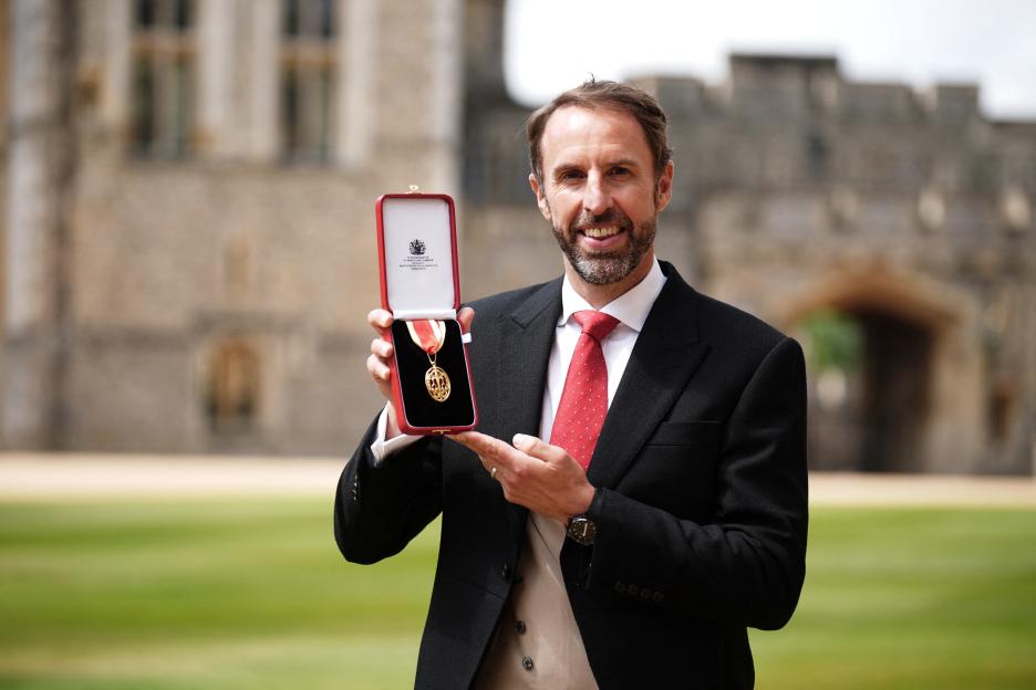 Gareth Southgate celebrating on the soccer field.
