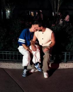 Couple sitting close together at night.