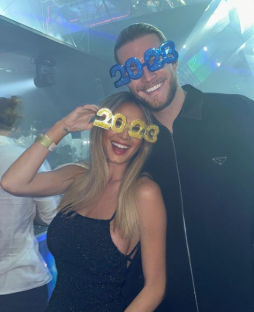 a man and a woman wearing glasses that say 2022