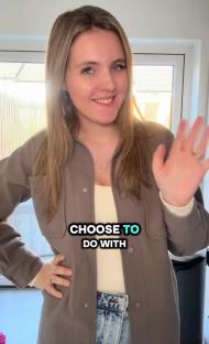 Woman waving and saying