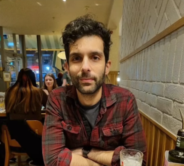 Modie Al-Shakarchi, 34, looking directly at the camera.