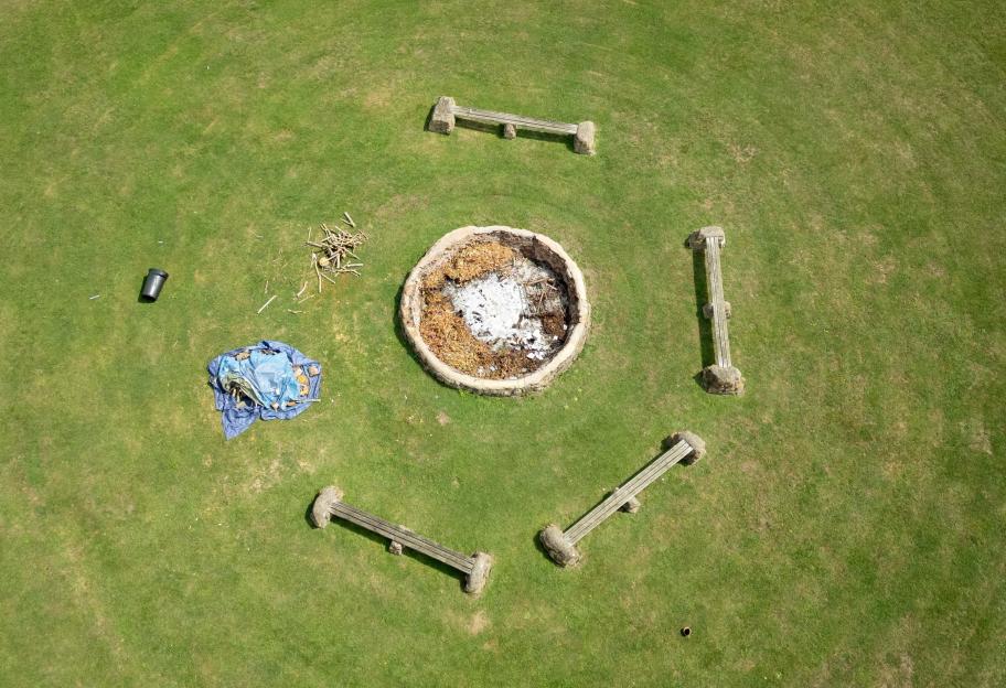 Aerial view of a fire pit surrounded by benches.