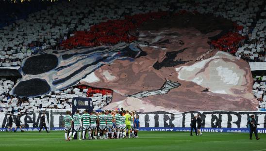 Rangers fans unveil giant ‘rebel scum’ banner with picture of man with shotgun pointing straight at Celtic support