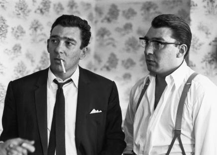 Black and white photo of Reggie and Ronnie Kray after spending 36 hours with police.