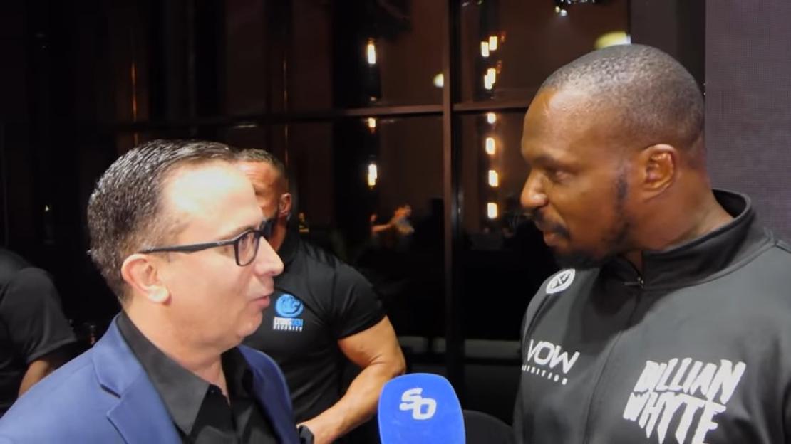 Dillian Whyte confronting an announcer.