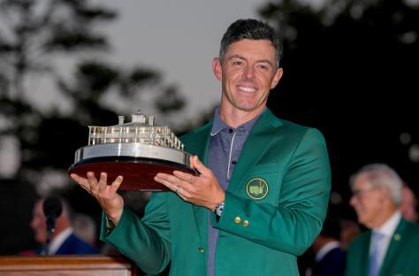 Rory McIlroy holding the Masters Championship trophy.