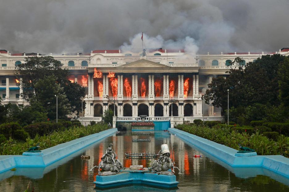 Singha Durbar, the main Nepali government building, on fire during a protest.