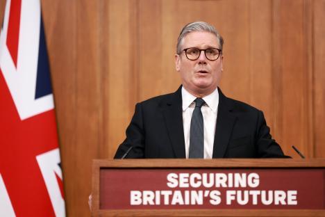 Keir Starmer giving a press conference on immigration.