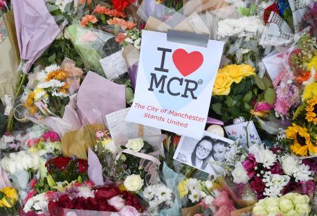 Floral tributes and messages of condolence in Albert Square and St. Anne's Square, Manchester.
