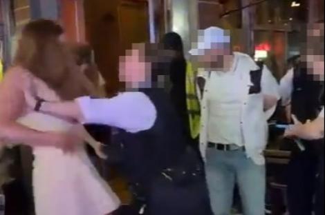 Moment rowdy female partygoer is tackled to the floor and arrested by cops outside pub as punters watch