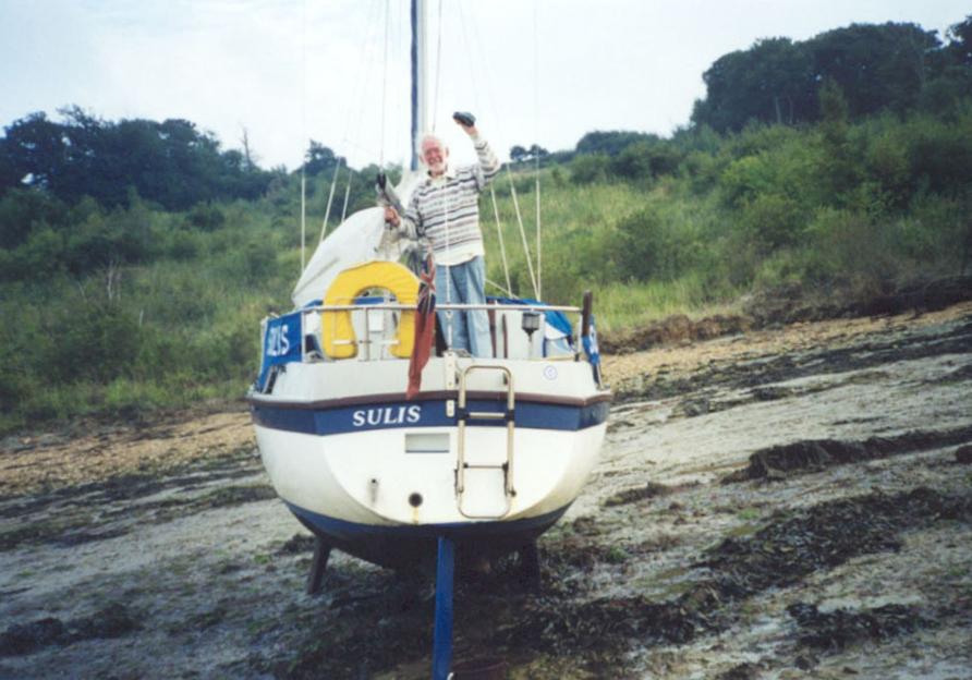 Rev Ronald Glazebrook standing on the boat "Sulis".