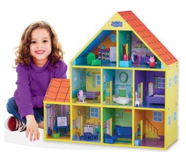 Girl playing with Peppa Pig dollhouse.