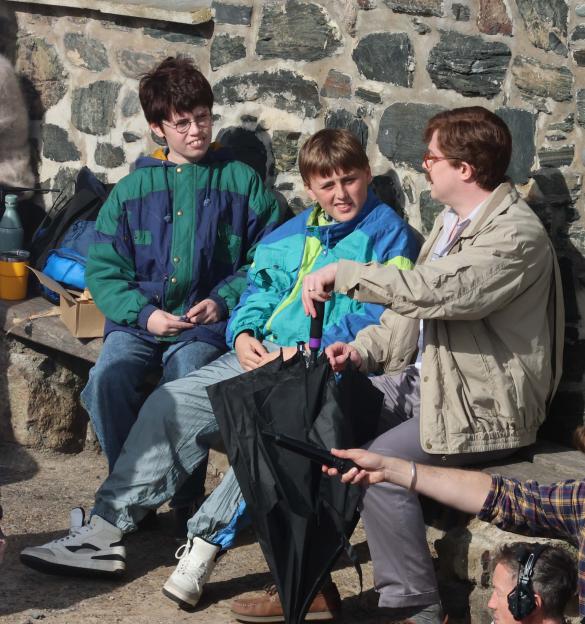 Actors Daniel Rigby, Bel Powley, and Amos Kitson filming as Uncle Vernon, Aunt Petunia, and Dudley Dursley, with a stand-in for Harry Potter, for the Harry Potter TV series.