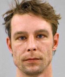 Mugshot of a man with light brown hair.