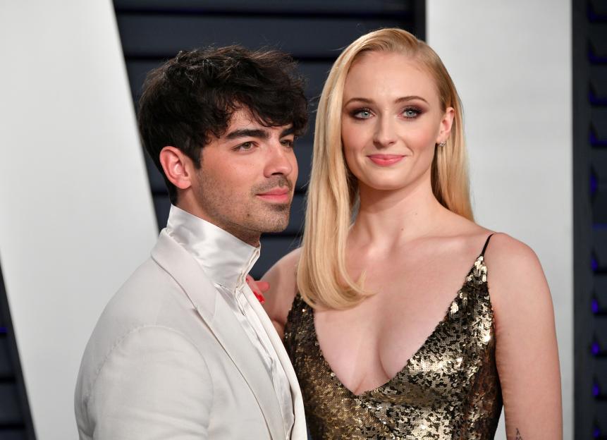 Joe Jonas and Sophie Turner posing together at an event.