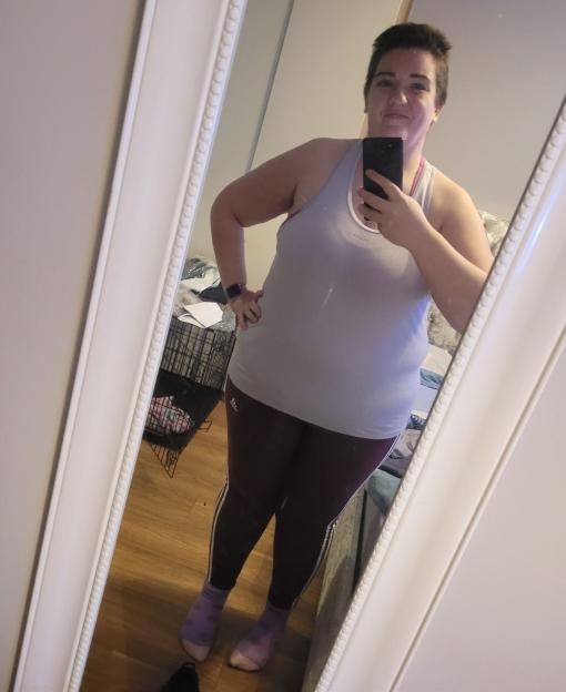 Woman taking a selfie in a mirror.