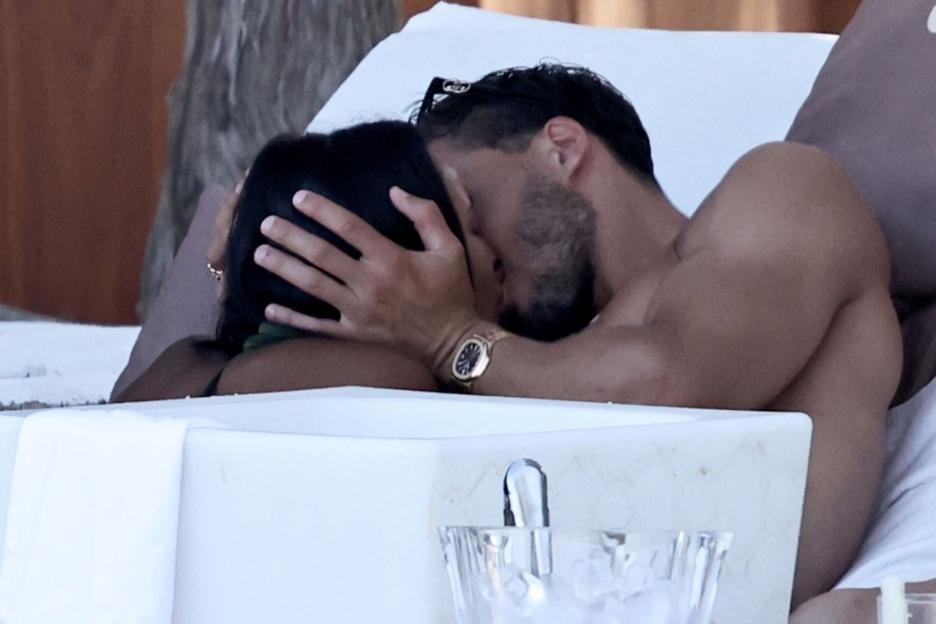 Maya Jama can’t keep her hands off footballer boyfriend Ruben Dias as they kiss at Ibiza beachclub