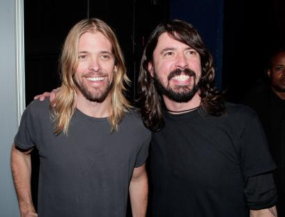 Taylor Hawkins and Dave Grohl of the Foo Fighters posing together.