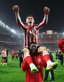 Sunderland's Chris Rigg celebrates a victory, carried on a teammate's shoulders.