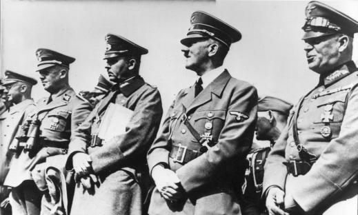Black and white photo of Hitler and other high-ranking Nazi officials.