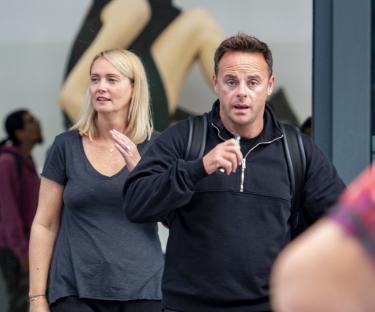MJ060922_19 - *EXC ALL ROUND* - London, UK Ant Mcpartlin and wife Anne-Marie celebrate their first wedding anniversary with a trip abroad alone. The pair were spotted landing back at Heathrow airport after a relaxing trip looking tanned and relaxed. Ant was spotted organising his wifes bags which he wheeled out the airport alongside their driver who was waiting for them. Ant was desperate for a quick vape after his flight and did so once outside the building. The tv presenter was dressed down in shorts and a hoodie teamed with a designer backpack and trainers. Anne Marie looked casual as well apart from her £2600 Large Christian Dior Book Tote which was balanced on the suitcases. Ant sported a £1600 Gucci backpack. The pair both had first class luggage tags attached to their baggage labels. Pictured : Ant Mcpartlin Anne Marie Mcpartlin19 Pricing : **ONLINE- STRICTLY NO ONLINE UNTIL 11.00AM ** **PAPERS- MIN£300 LARGE PG 1 TO BE AGREED** **MAGAZINES - Call for Pricing- FEE TO BE AGREED** ------- ijo@mj-pictures.com - 07929331170